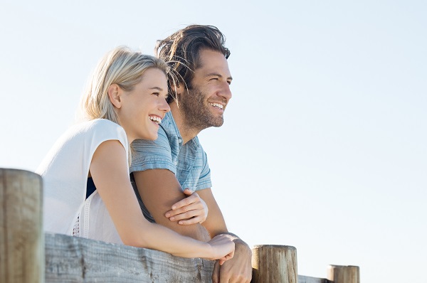 Man and woman stood together looking at scenery